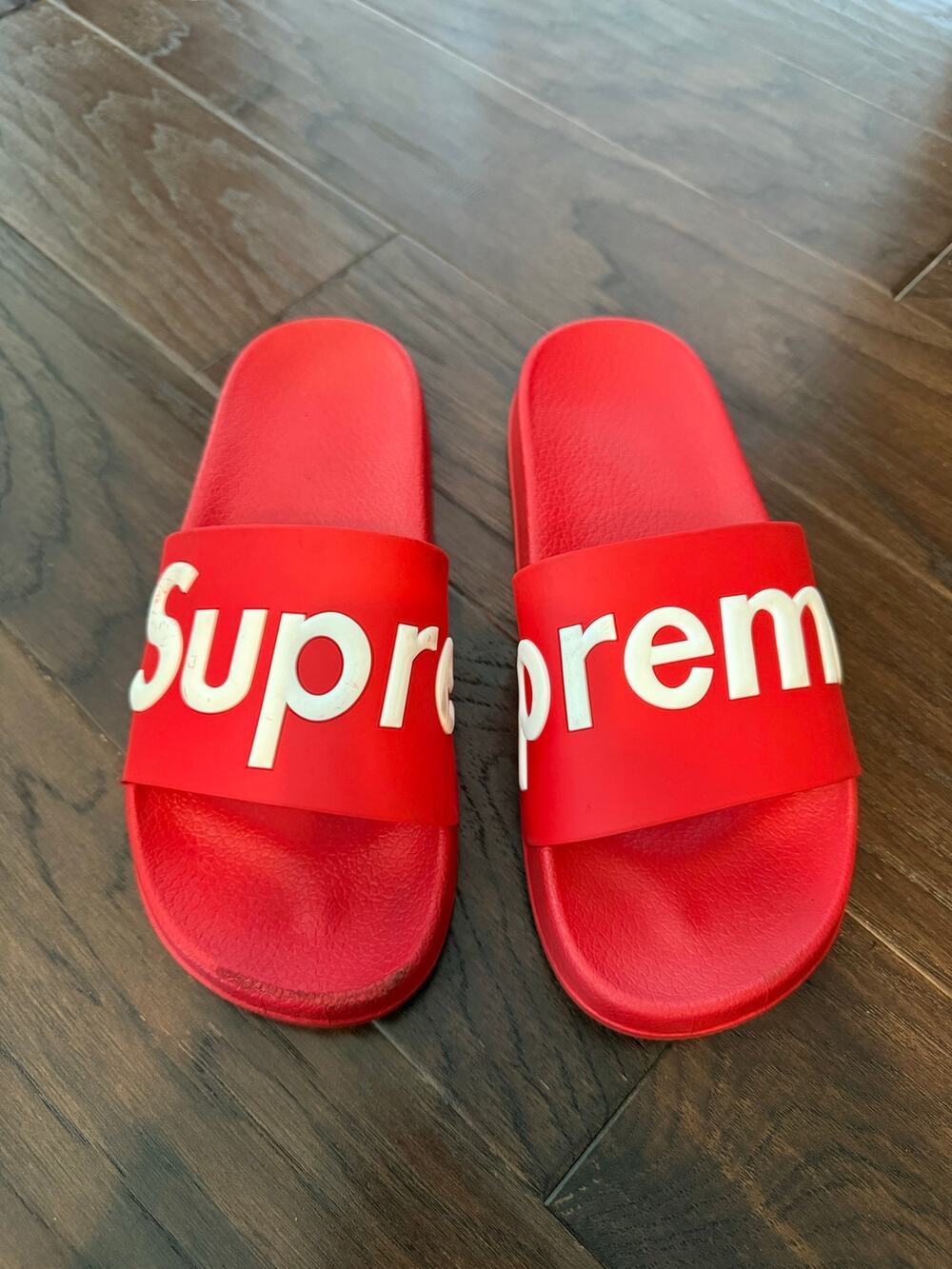 Red Slides Sandals say Supreme across top. Men’s size 9